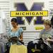 Fans wait in a line wrapped around the the second floor of the M Den in order to meet Michigan football star Desmond Howard during an autograph signing at the M Den on Friday.  Melanie Maxwell I AnnArbor.com